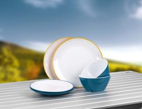 Colourful tableware set in the colours petrol and yellow